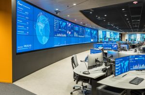 Akamai operations center featuring large curved video wall and pod console furniture