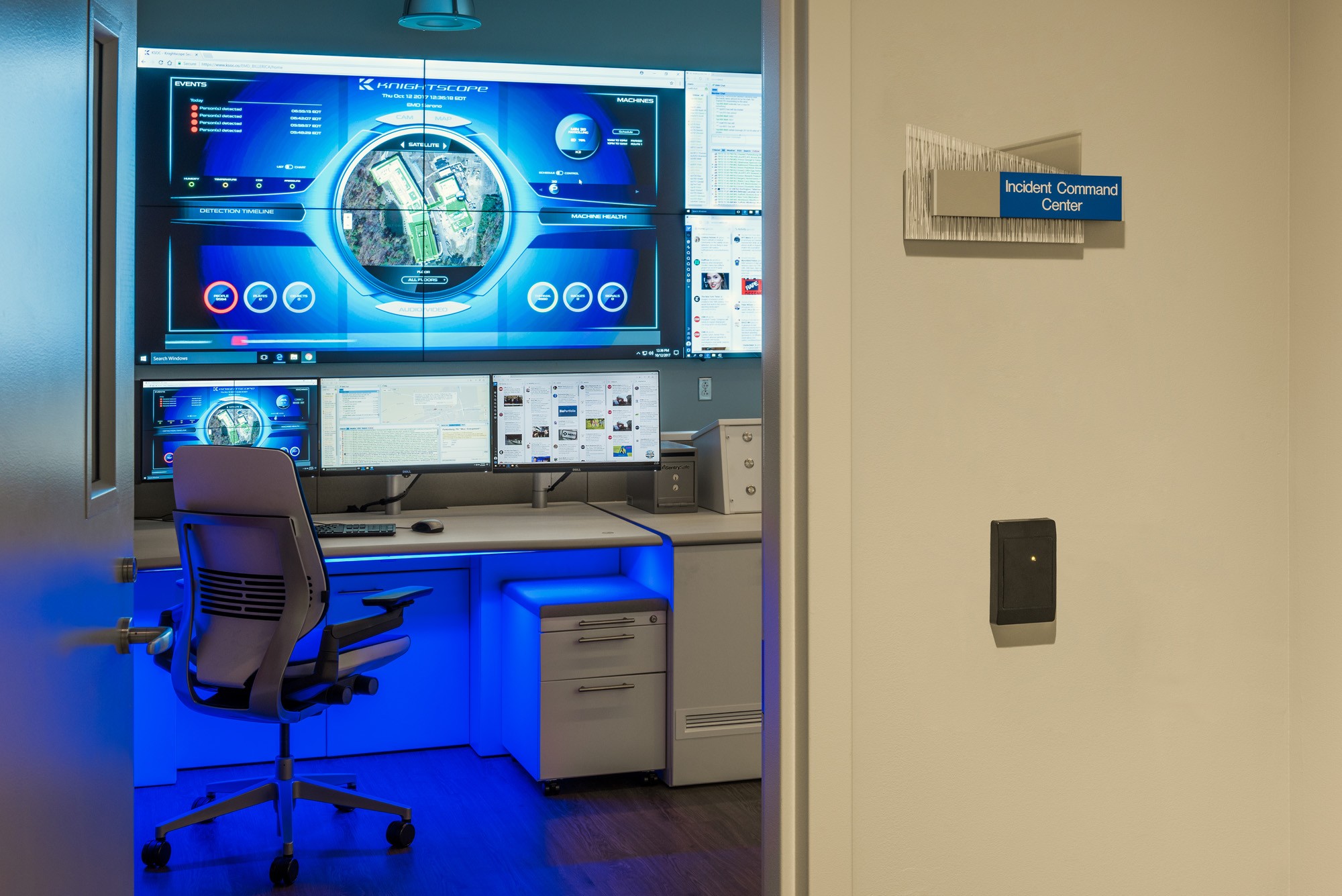 view into a command center with dramatic blue light