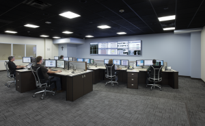 operations center picture with consoles and video wall