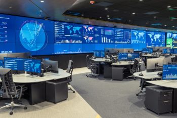 An Operations Center with a large video wall and consoles