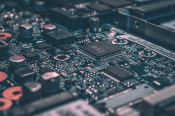 Circuit board with microchips and electronic components for operations center technology systems