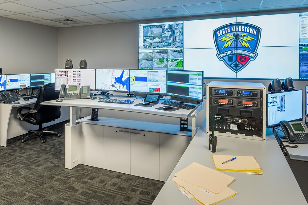 view of sit stand desk in public safety communications center