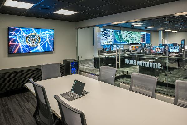conference room adjacent to an operations center which shares risk intelligence
