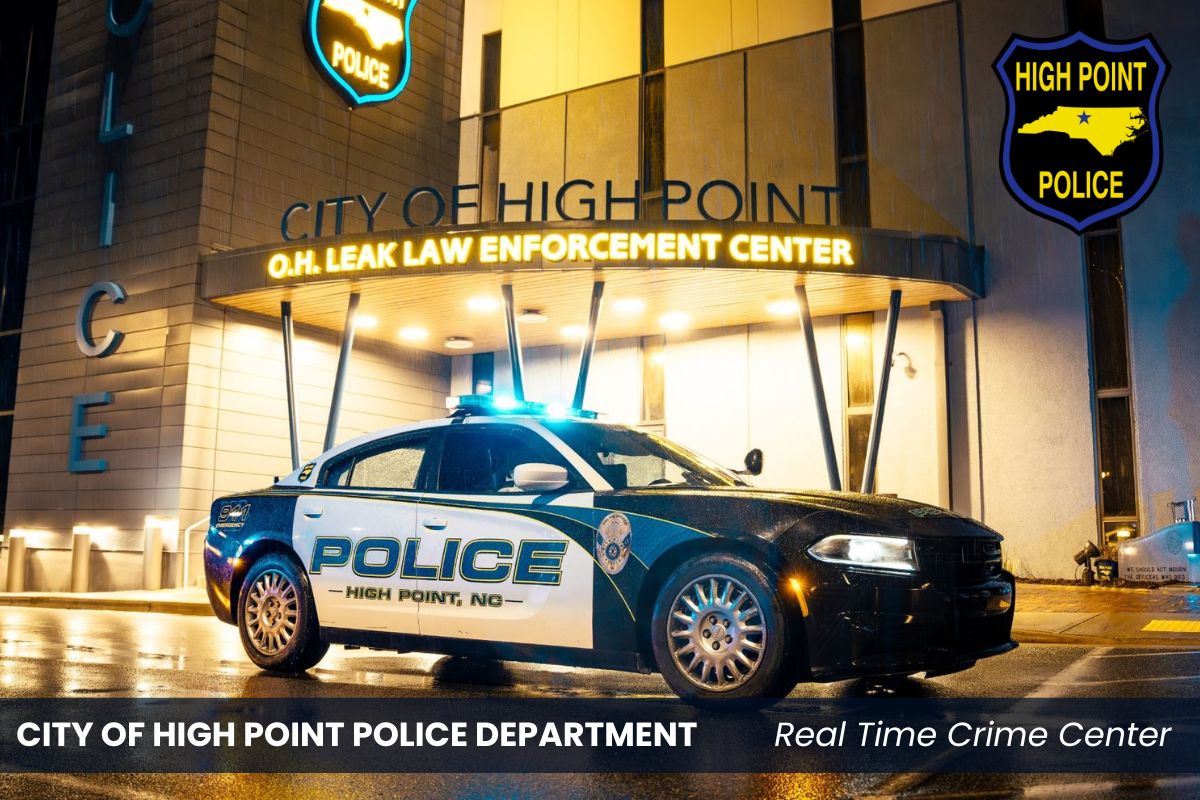 a police car is parked in front of the city of high point police department