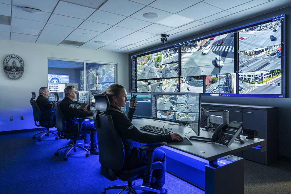 Glendale Police Department RTIC monitoring room with video wall displaying multiple feeds of streets